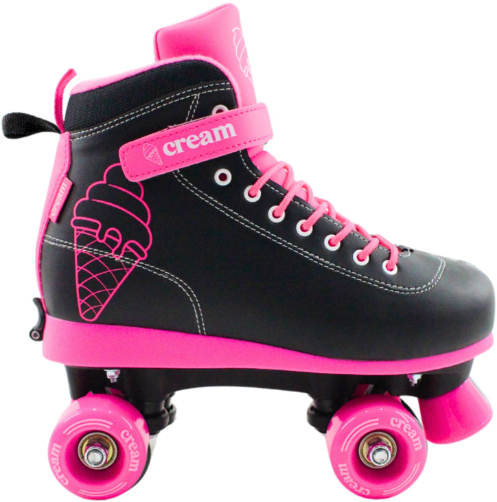 The CREAM Scoop Vivid Adjustable Quad Roller Skates in black and pink feature vibrant pink wheels, matching laces, and an adorable ice cream cone design on the side. Made from durable vegan leather, these beginner-friendly roller skates showcase the word "cream" on both the strap and wheels for a playful touch of sweetness.