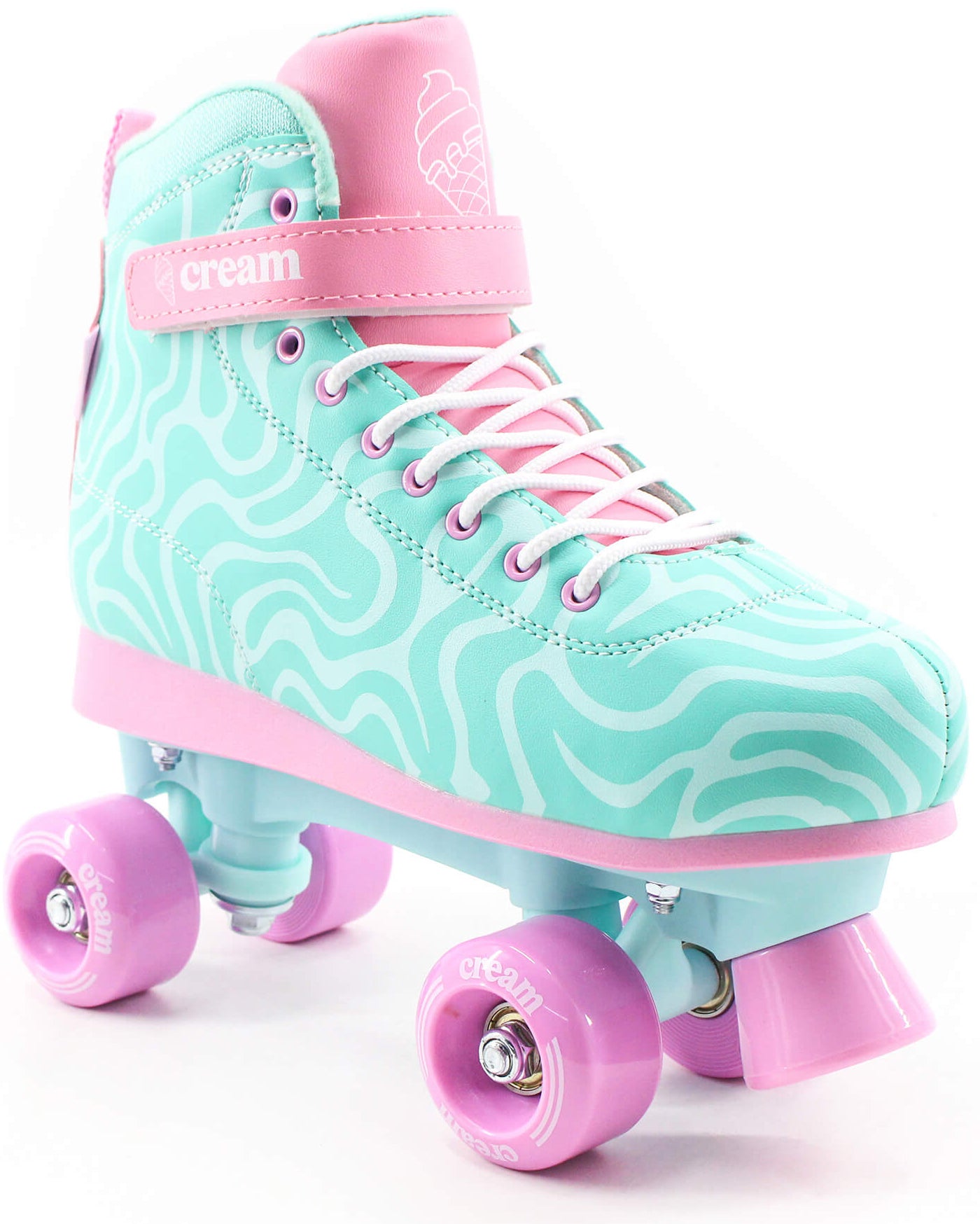 The CREAM Scoop Wave Adjustable Quad Roller Skates in teal and pink feature a wavy design, are made from high-quality vegan leather, and include pink laces, a pink toe stop, and pink wheels. These adjustable beginner quad skates showcase the word "cream" on both the side and the wheels.