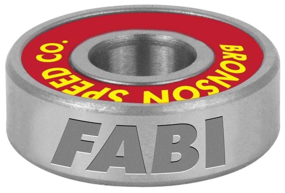 A close-up of a Bronson Fabiana Delfino Pro G3 bearing reveals a metal design with a red inner ring featuring yellow text and "FABI" boldly displayed in gray on the outer surface, maintaining a sleek metallic finish to enhance your skateboard's performance.