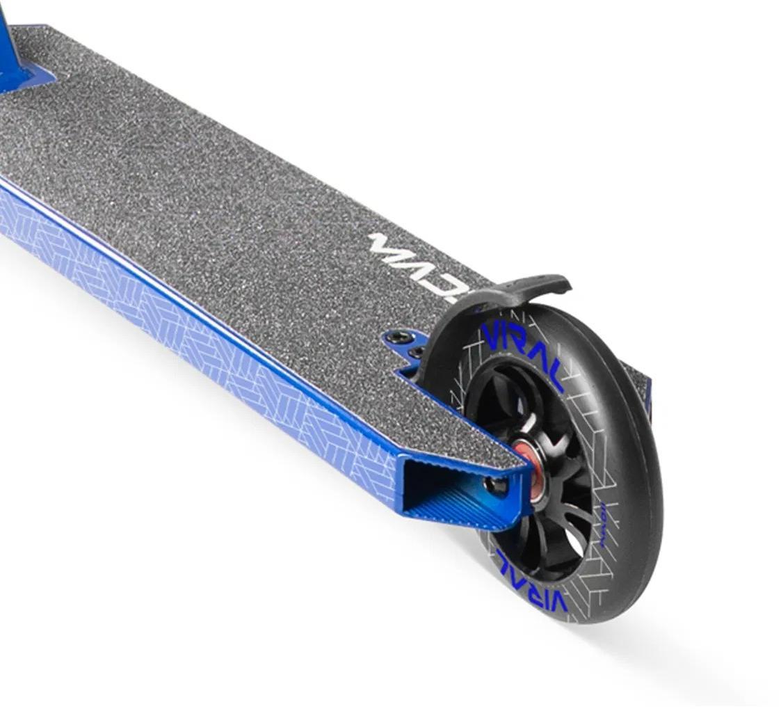 Close-up of the rear wheel and deck on the Madd Gear Viral Purge Complete Stunt Scooter in cobalt, showing its textured grip, geometric patterns, and "VIRAL" branding—ideal for MGP fans ready to ride at the skatepark.