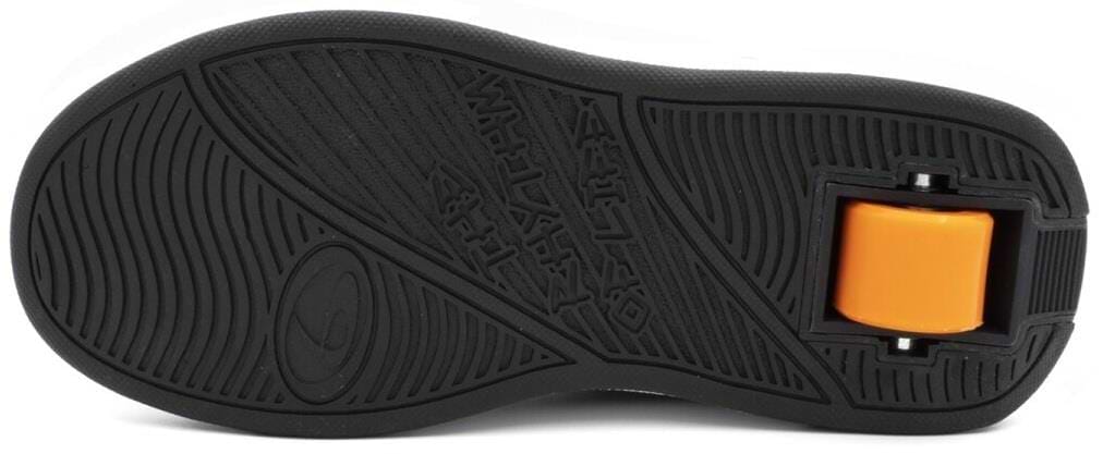 A close-up of the Breezy Rollers Hero 2 Shoes - Black / Green shows a black rubber sole with an orange wheel near the heel, showcasing Breezy Rollers' patented wheel system for skating or rolling.