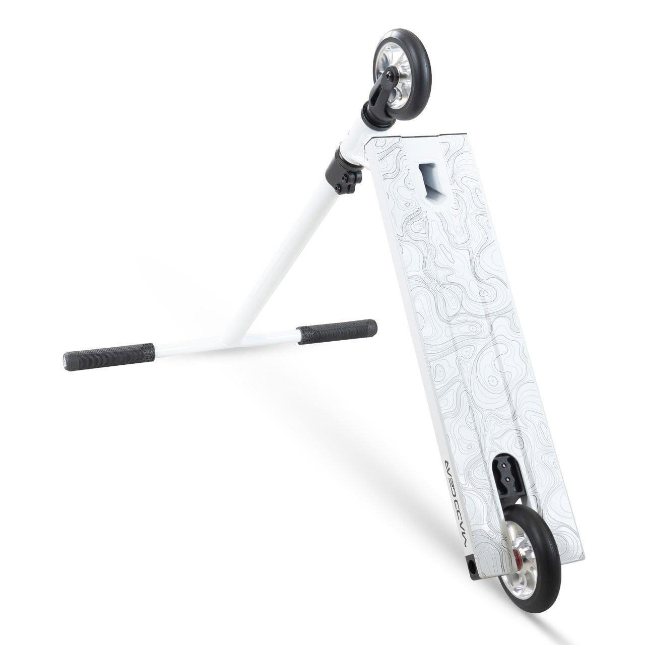 The Madd Gear (MGP) MG 4 Titan Complete Stunt Scooter in Arctic White features a textured deck, black handgrips, and black wheels—shown dynamically for action sports on a crisp white background.