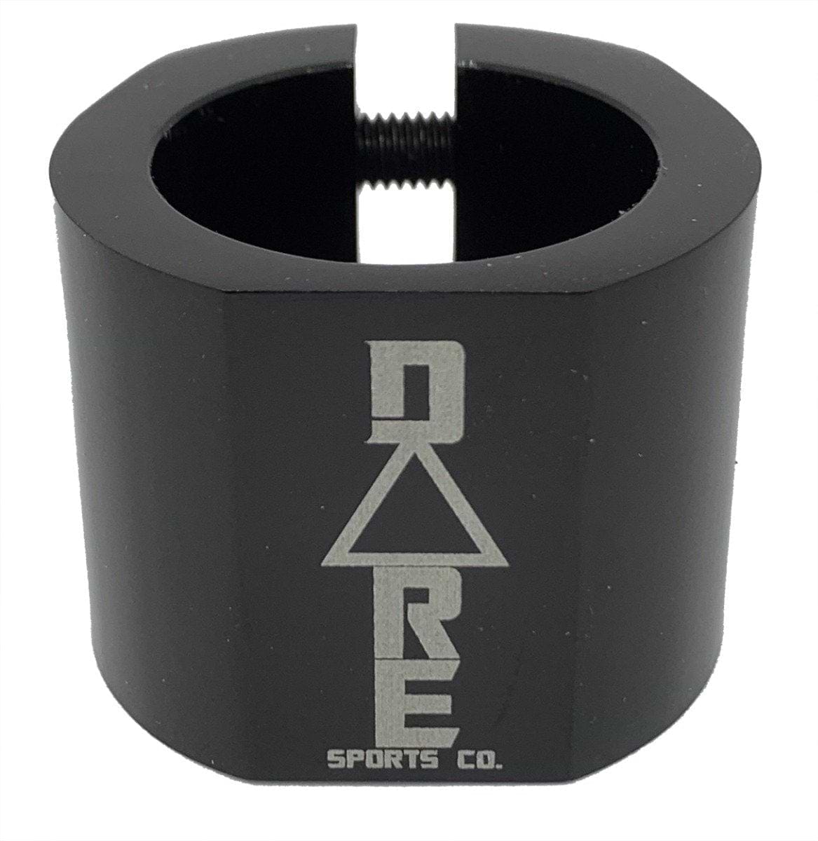 The Dare Warlord 2 Bolt Standard Stunt Scooter Clamp in black, crafted by Dare, is a CNC machined, lightweight metal clamp featuring a hexagonal shape with an engraved "Dare" name and a slit for tightening. It offers exceptional grip and durability, making it perfect for extreme sports enthusiasts.