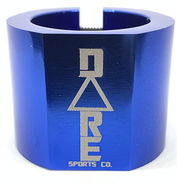 The Dare Warlord 2 Bolt Standard Stunt Scooter Clamp by Dare, in a striking blue metallic finish, is crafted from robust 6061 T6 aluminium and showcases the "DARE SPORTS CO." branding engraved in silver, featuring an innovative triangular design integrated into the lettering.