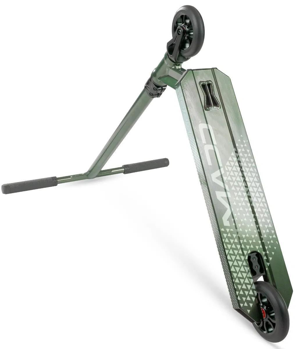 The Madd Gear Viral KAOS Complete Stunt Scooter - Forest features a green deck with geometric white patterns, black griptape, black wheels, and straight handlebars with black grips—ideal for progressing your stunt skills.