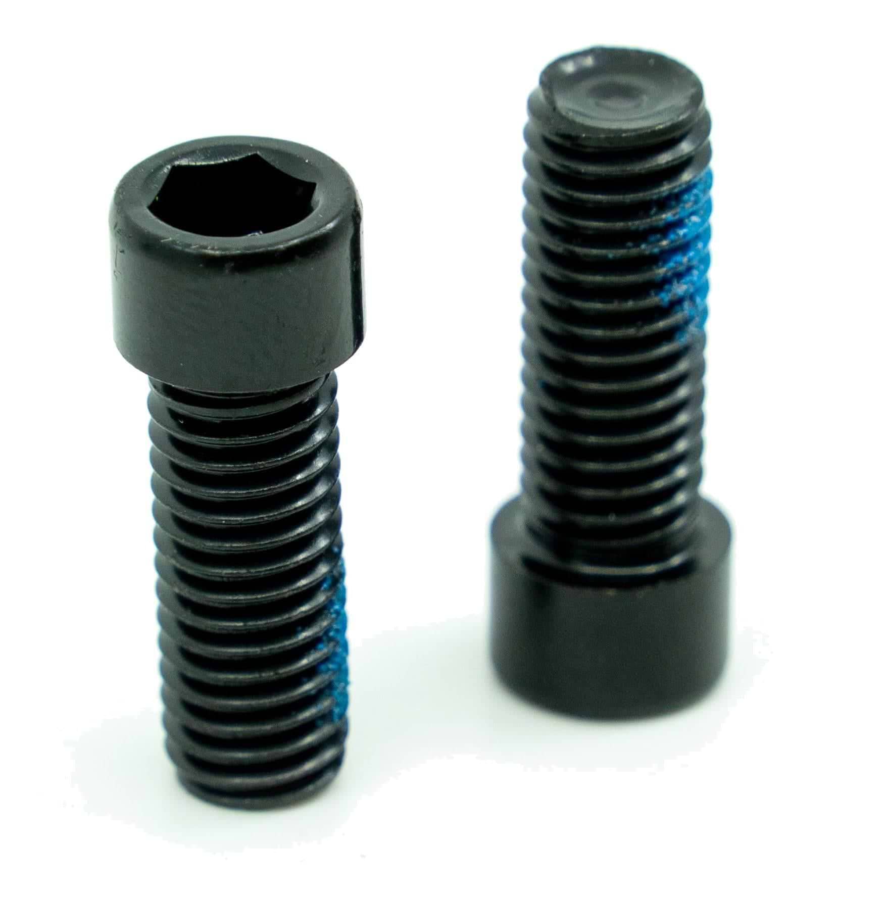 Two black CORE Replacement M8 Stunt Scooter Clamp Bolts (Pair) by CORE stand upright with visible blue thread-locking compound on their threads, shown against a white background.