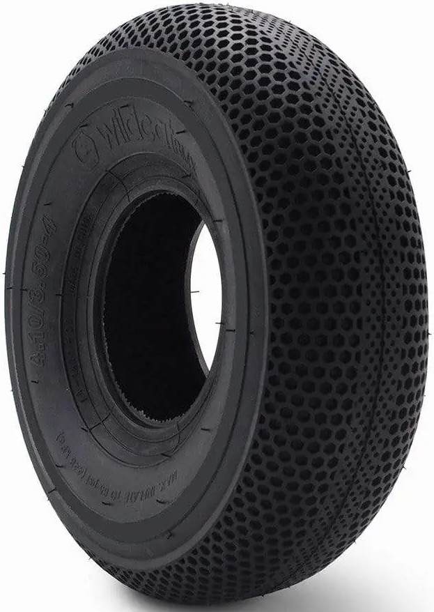The Wildcat Original Pro 10" Mini BMX Tyre in solid black features a honeycomb tread for grip and shock absorption, embossed technical sidewall details, and Wildcat branding. Photographed against a white background.