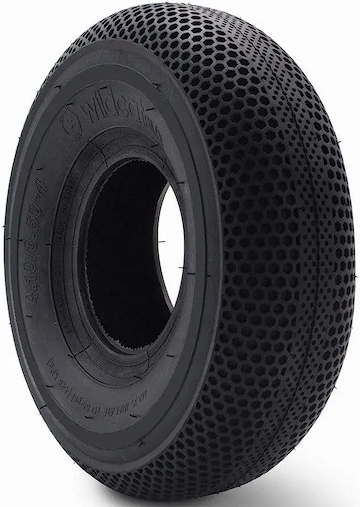 The Wildcat Original Pro 10" Mini BMX Tyre in solid black features a honeycomb tread for grip and shock absorption, embossed technical sidewall details, and Wildcat branding. Photographed against a white background.