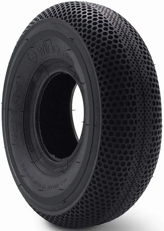 The Wildcat Original Pro 10" Mini BMX Tyre in solid black features a honeycomb tread for grip and shock absorption, embossed technical sidewall details, and Wildcat branding. Photographed against a white background.