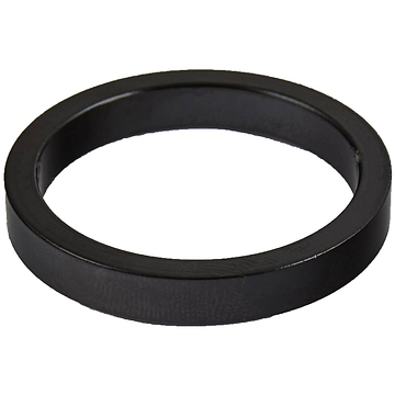 A circular Dial 911 Scooter Headset Spacer - 5mm in black, viewed from an angle, features a flat and smooth surface. The evenly shaped spacer is displayed on a plain white background.