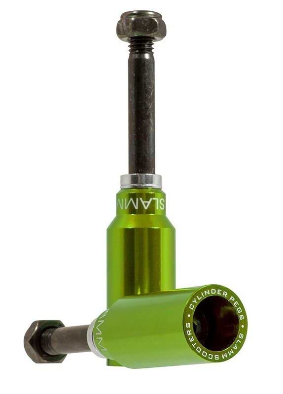 Two green Slamm Cylinder Stunt Scooter Pegs are shown in an L shape—one upright, one lying flat—with branded text from Slamm visible around the circular end. Bolts are also included.