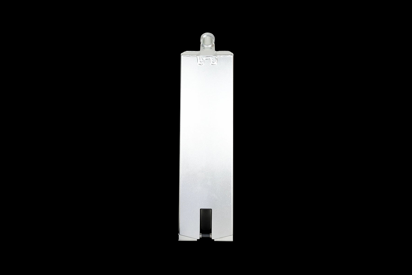 A tall, rectangular object made from 6000 series aluminum with a smooth surface and a small, rounded protrusion on top, reminiscent of the sleek design of the Supremacy Spartan Chrome Silver Stunt Scooter Deck - 5.5" x 20.5", is set against a stark black background.