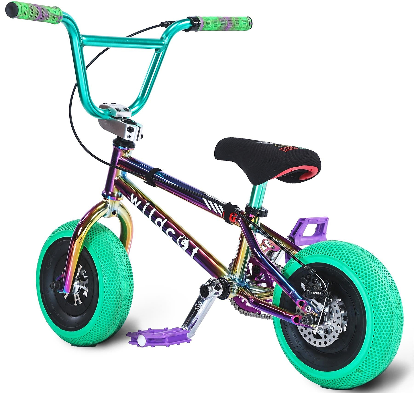 The Wildcat OG Pro Mini BMX Bike - Joker Green Hulk features thick bright green tires, a multicolored metallic frame, green grips, and a black seat, with the angle highlighting its Turbo rear wheel design and brake disc.