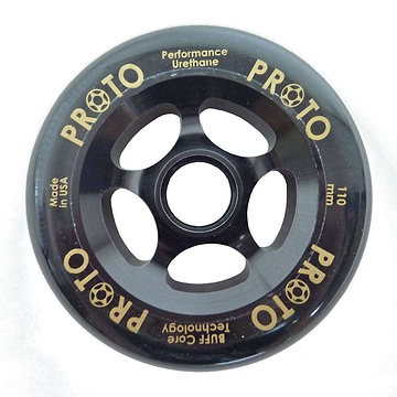 The Proto Gripper 110mm Stunt Scooter Wheel in black, featuring a five-spoke design, highlights gold text that reads "Performance Urethane," "PROTO," and "110 mm." Lightweight at only 220g, it boasts the innovative BUFF Core Technology and proudly displays "Made in USA.