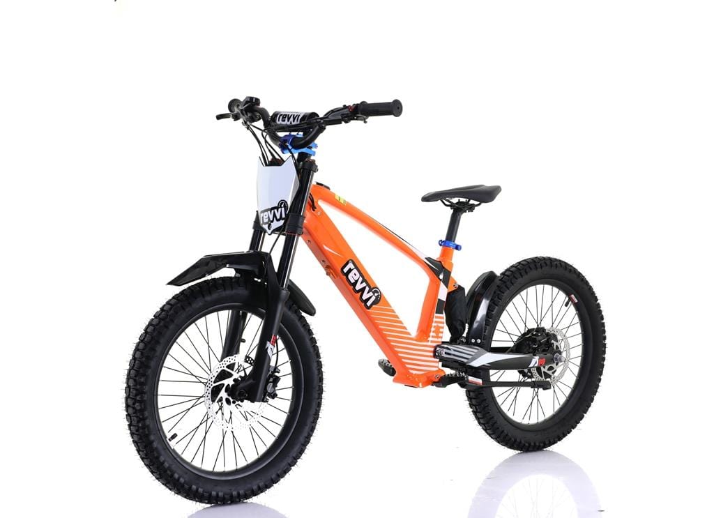 The Revvi 20" Kids Electric Balance Bike - Orange features a sturdy frame with off-road rubber tires and front suspension. The sleek design showcases the Revvi logo on the frame and handlebars, all presented on a reflective white surface to highlight its dynamic appeal.