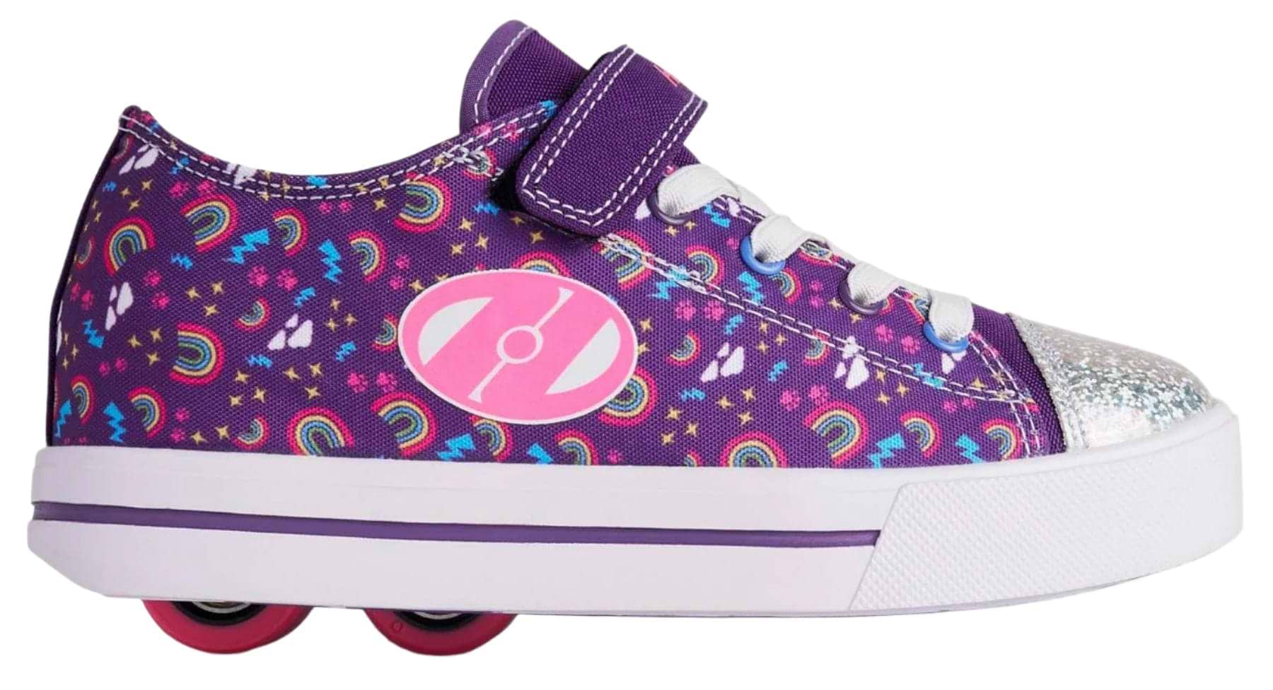 The Heelys Snazzy X2 Girls Shoes in Purple/Multi/Rainbow feature star and rainbow accents, white laces, a sparkly silver toe, ABEC 3 bearings, and dual pink wheels in the heel for colorful rolling fun.
