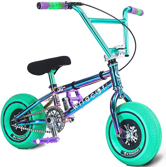 The Wildcat OG Pro Mini BMX Bike - Joker Green by Wildcat features a small metallic frame with "WILD CAT" on the side, bright teal turbo-style tires, purple pedals, and green and purple handlebar grips.