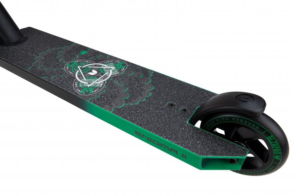 Close-up of the Blazer Pro Enigma 2 Complete Stunt Scooter deck with a green and black abstract design. The rear wheel showcases a black tire accented with green, and the side features the "ENIGMA II" print, making it ideal for beginners.
