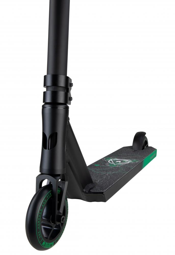Close-up of the Blazer Pro Enigma 2 Complete Stunt Scooter in black and green, showcasing its chromoly steel wing bars. The emphasis is on the front wheel and handlebars, while the deck features a textured grip with a green logo. Ideal for beginner-friendly rides, this Blazer Pro scooter stands out against a white background.