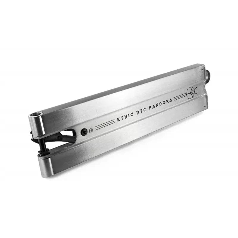 The Ethic DTC Pandora Raw Silver Stunt Scooter Deck, measuring 5.1" x 20.5", is a sleek silver masterpiece. Its minimalist design is beautifully highlighted from an angle, showcasing the streamlined form and innovative build that sets it apart.