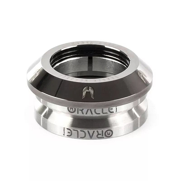 Close-up of a metallic scooter headset bearing, labeled "ETHIC," featuring a glossy chrome black finish against a white background. This Ethic DTC Oracle Integrated Stunt Scooter Headset incorporates an enhanced compression ring to minimize friction, ensuring top performance under diverse conditions.