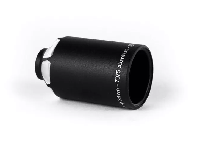 A black Ethic DTC 12 STD Stunt Scooter Peg, made of 7075 aluminum and measuring 60mm in length, lies on its side against a white background. The peg is a specialized mechanical component with a smooth, matte finish.