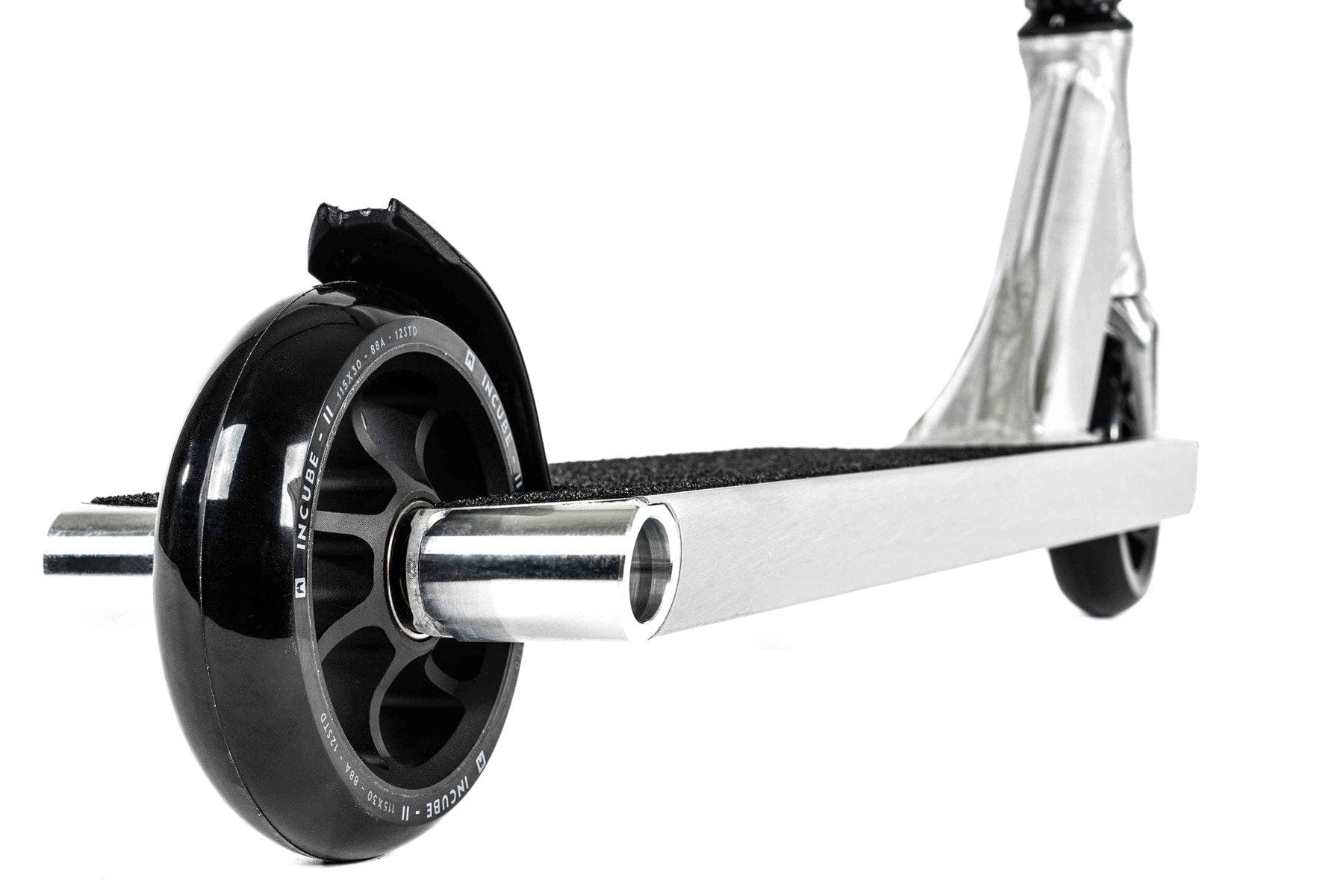 Close-up of the Ethic DTC Pandora Complete Stunt Scooter (M) - Brushed Silver, a sleek and modern street-oriented scooter featuring black wheels and a shiny metallic frame. The deck includes a textured, anti-slip surface, while the high-strength chromoly steel T-bar ensures ultimate control.