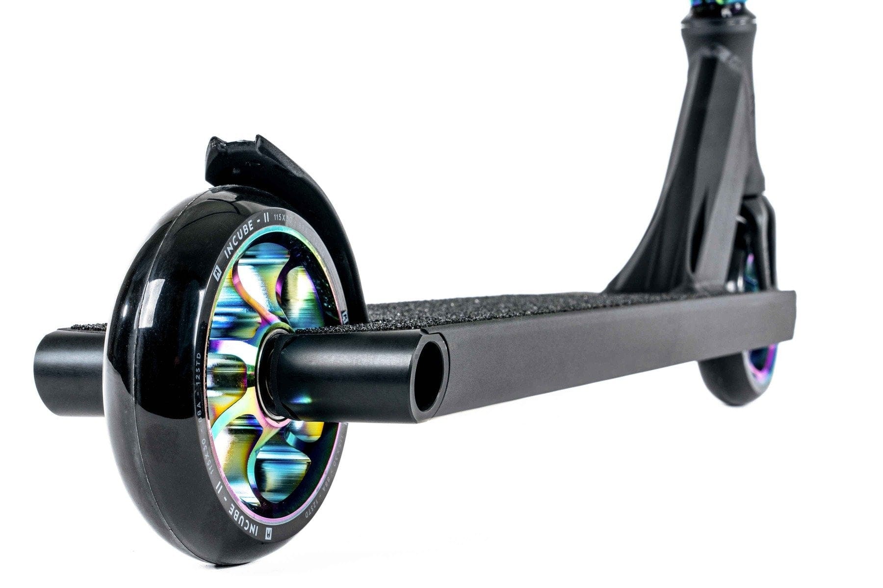 Close-up of a sleek and stylish Ethic DTC Pandora Complete Stunt Scooter (M) in Neochrome, showcasing its multicolored wheels. The deck is designed with a textured surface for enhanced grip, and the prominently visible front wheel contrasts beautifully against a white background.