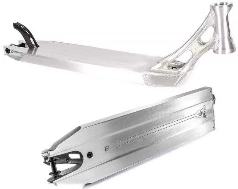 The Ethic DTC Vulcain V2 12 STD Raw Silver Stunt Scooter Deck, measuring 5.5" x 21.25", showcases a sleek silver design with geometric cut-out patterns near the handlebar area. This adaptable deck features a smooth surface and an elevated rear for added support, while the bottom is intricately engraved and equipped with a 12 STD bearing system for enhanced style and grip.