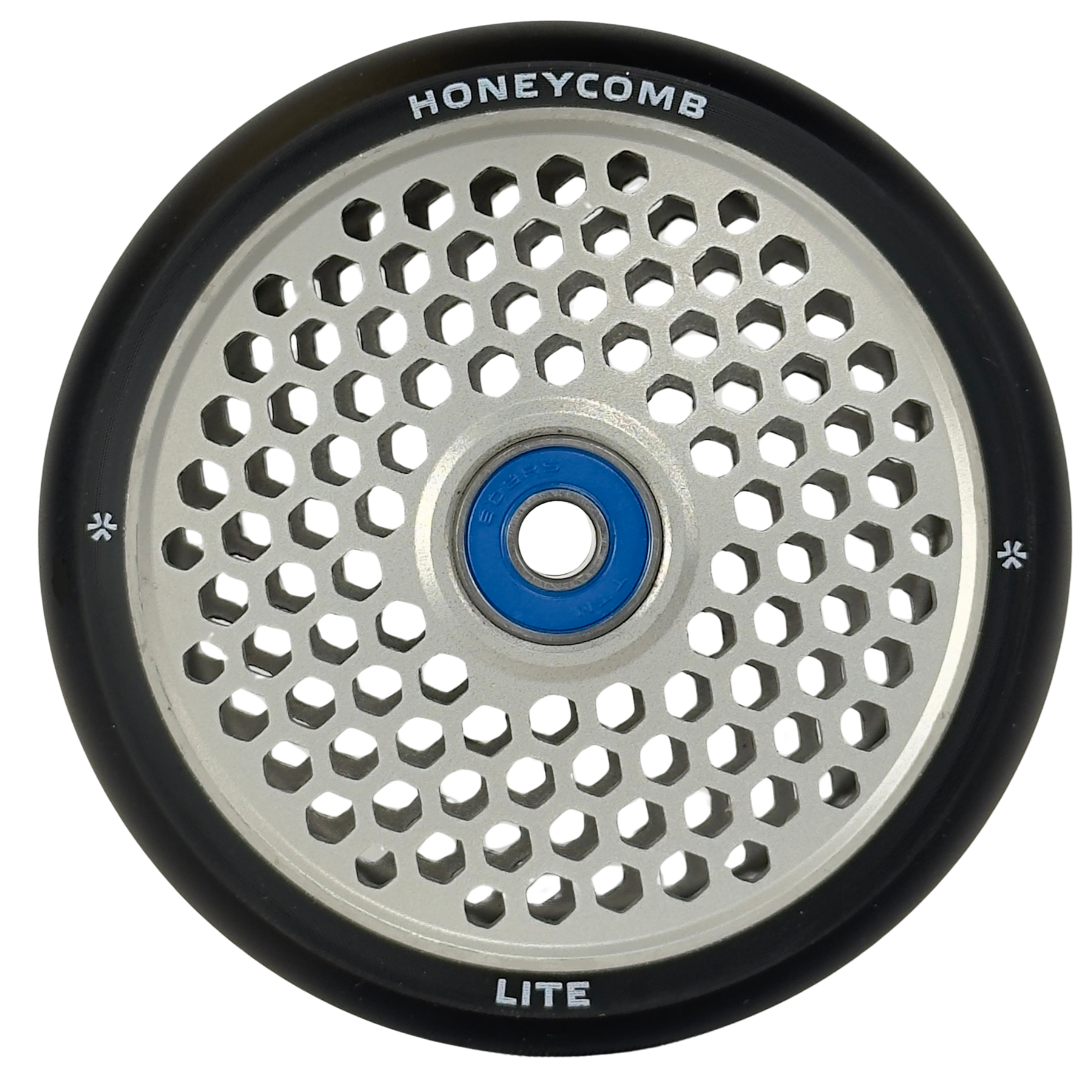 A close-up of the Union Honeycomb Lite 110mm Stunt Scooter Wheel by Union, featuring a silver honeycomb-patterned core, blue bearing, black rubber edges, and "HONEYCOMB" and "LITE" text on the rim.