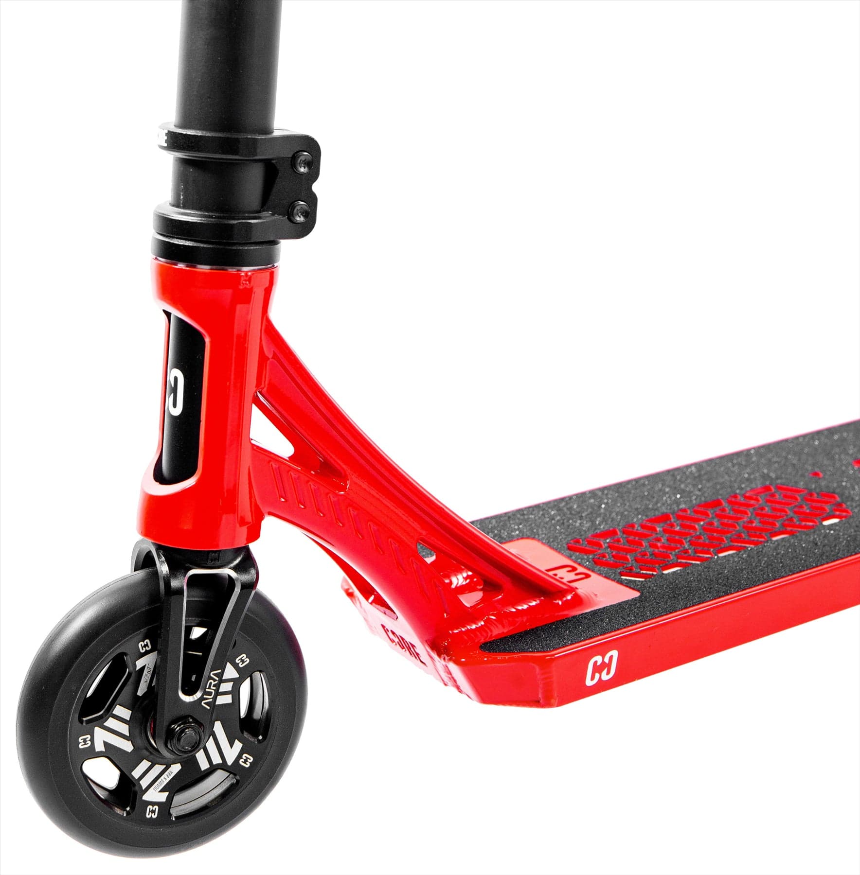 Close-up of the CORE SL3 Complete Stunt Scooter by CORE in red/black, showing the front wheel with a black and silver spoke design, black grip tape on the deck, and part of the handlebar stem.