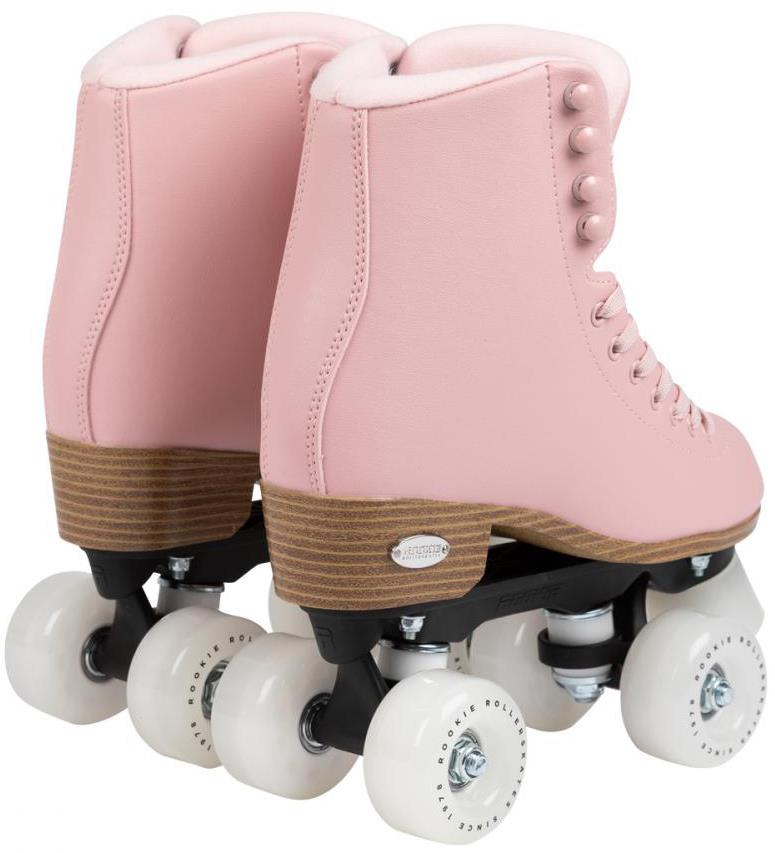 A pair of Rookie Classic 78 Quad Roller Skates - Pink by Rookie, featuring white wheels and wooden-look soles, are placed side by side facing away from the camera.