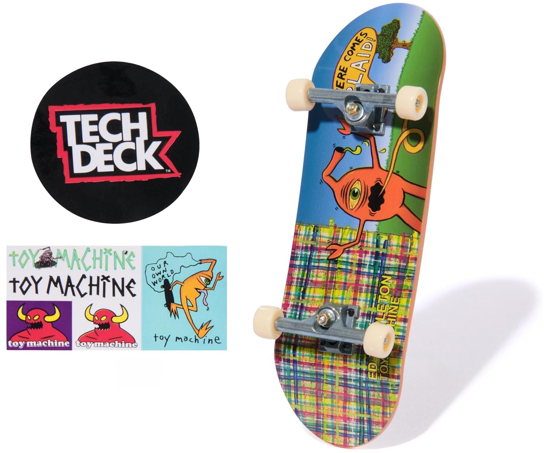 The Tech Deck 96mm M57 Fingerboard - Toy Machine stands upright with a vibrant cartoon design and yellow wheels, alongside Tech Deck and Toy Machine stickers—ideal for collectors and fans of fingerboards.