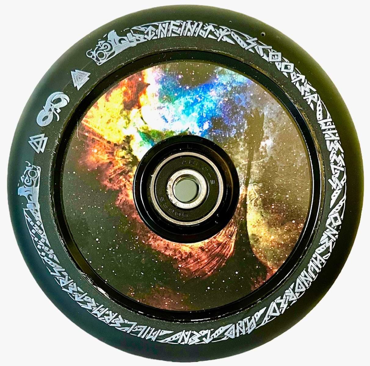 The Infinity Viking 110mm Hollowcore Stunt Scooter Wheel - Galaxy, by Infinity, showcases a vibrant galaxy design on the inner hub and features laser-etched runes around the rim. Crafted from high rebound PU, these wheels offer smooth rides while being both lightweight and stylish.