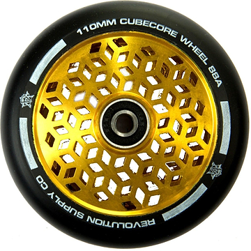 A close-up of the Revolution Cubed Core Ultralite 110mm stunt scooter wheel showcases its sleek black outer rim and dazzling golden honeycomb pattern core. The edge features the text "110MM CUBECORE WHEEL 88A," representing Revolution's ultralite scooter wheels collection.
