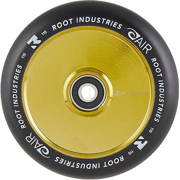 Close-up of a Root Industries AIR Hollowcore 110mm stunt scooter wheel, showcasing its shiny gold core and black outer rubber. "Root Industries" and "AIR Hollowcore" are printed in white around the edge.