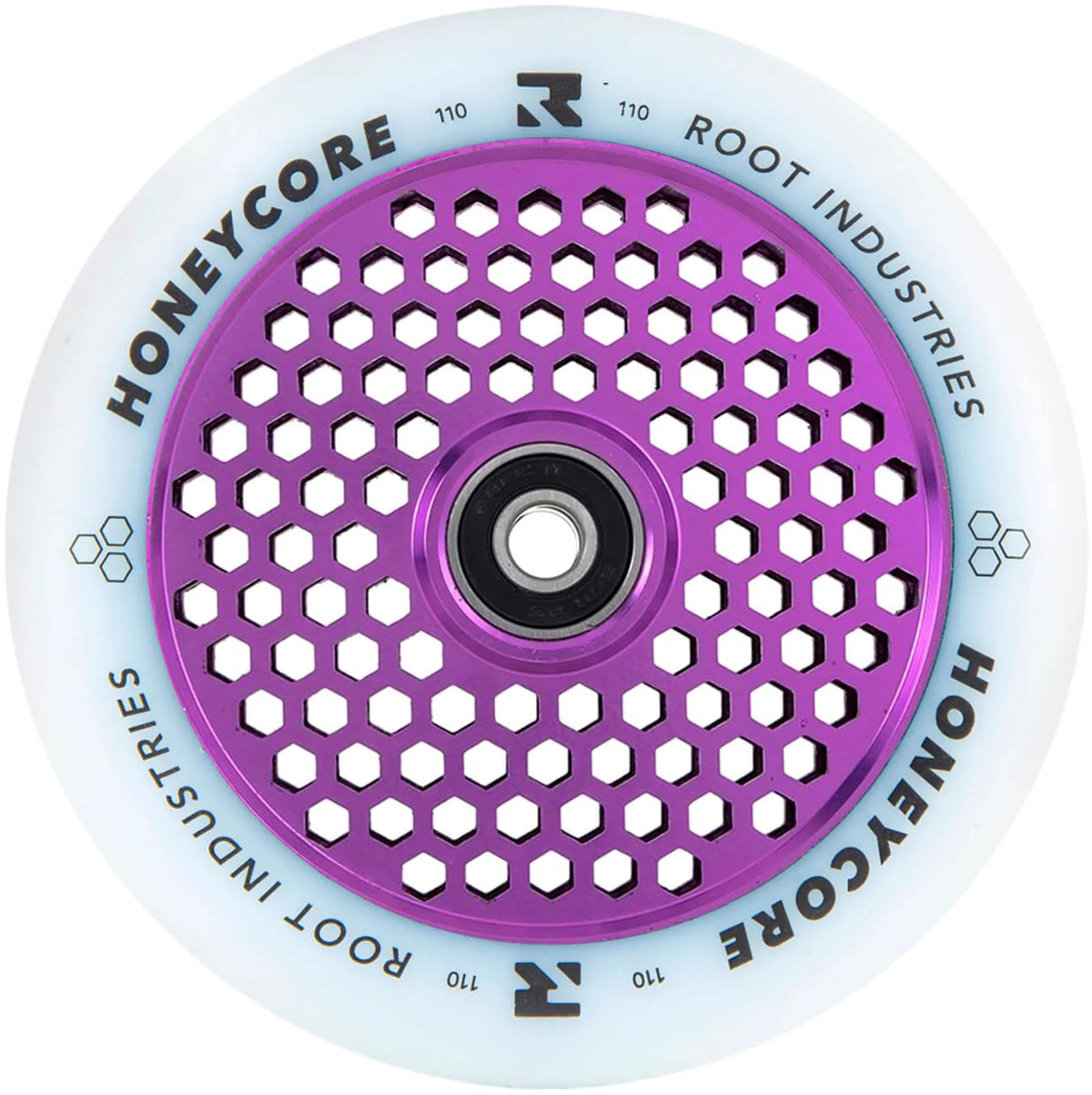The Root Industries Honeycore 110mm Stunt Scooter Wheel - White / Purple features a white wheel with a purple, honeycomb-patterned metal core and has “ROOT INDUSTRIES” and “HONEYCORE” printed in black around the outer edge.