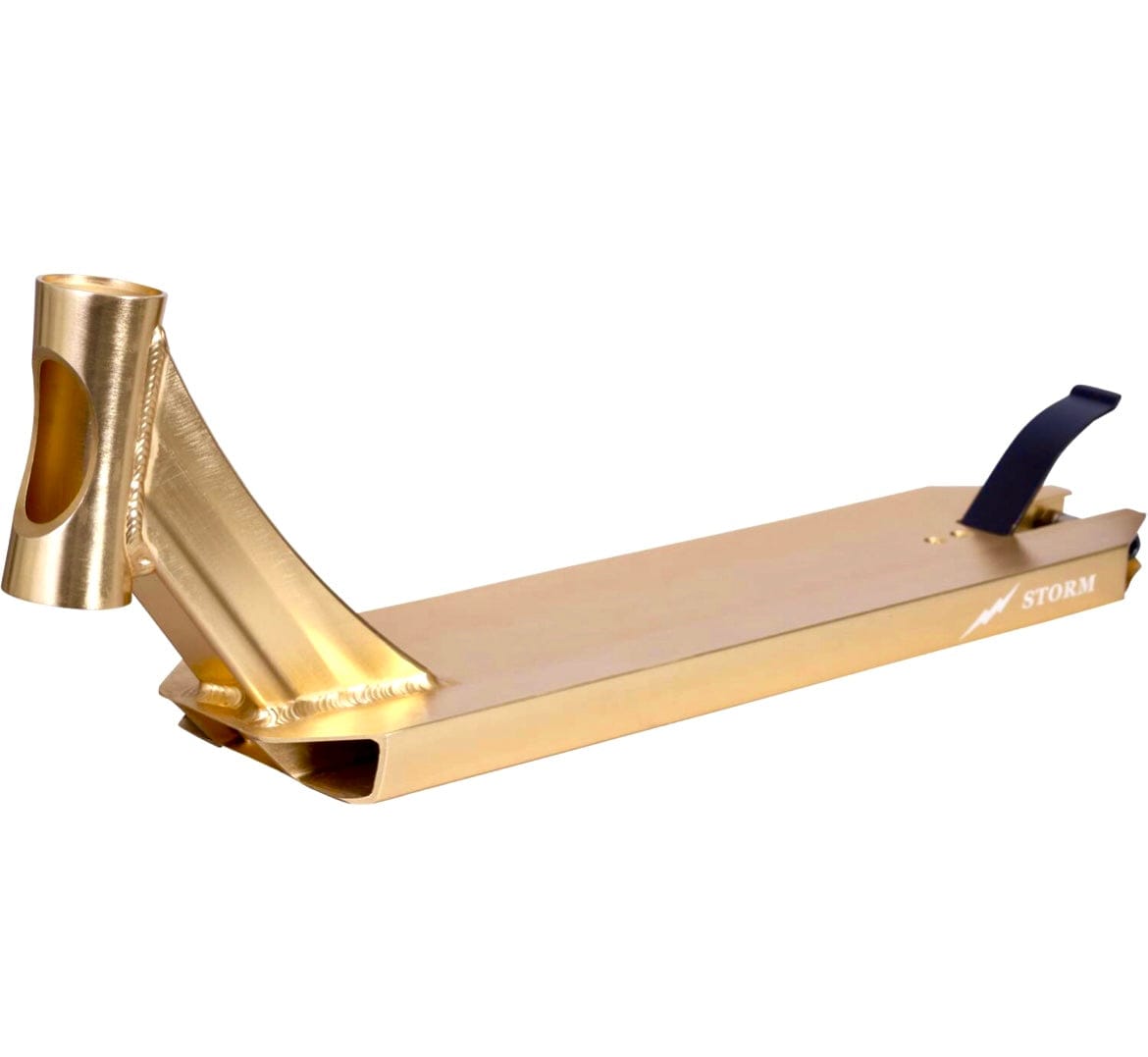 The Revolution Storm Gold Chrome Stunt Scooter Deck, measuring 4.7" x 19", features a stylish gold chrome finish with an angular headtube and black grip tape towards the rear. The word "STORM" alongside a lightning bolt accentuates the side, making it perfect for park riders seeking a standout design.