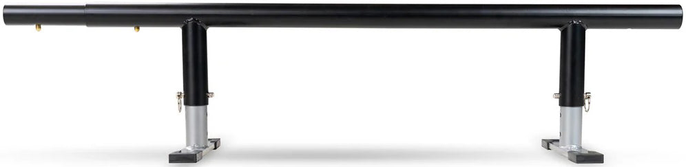 A Madd Gear black metal grind rail with two sturdy supports and flat bases, set against a white background, is compatible with the Madd Gear MGP Grind Rail Extension Kit - 91cm for added length.