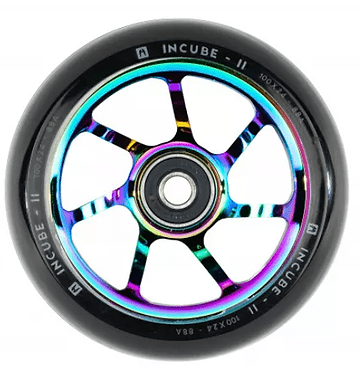 The Ethic DTC Incube V2 100mm Stunt Scooter Wheel in Neochrome boasts rainbow-colored metal spokes paired with a black rubber tire. The outer rim is labeled with "Incube V2" and "100x24 - 88A." Its design, crafted by Ethic DTC, showcases a central hub and six evenly spaced spokes.
