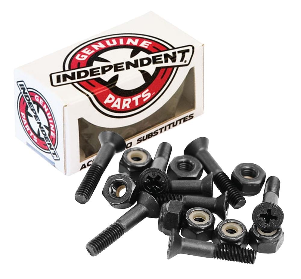 A box labeled "Independent Phillips Skateboard Bolts - Black 7/8"" is in the background. In front, there are several black screws, washers, and nylon lock nuts scattered on a white surface.