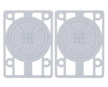 A pair of white skateboard risers featuring the "Independent Truck Company" logo with a cross design. The Independent Skateboard Riser Pads, measuring 1/8", have multiple slots for mounting and are perfectly compatible with Indy trucks.