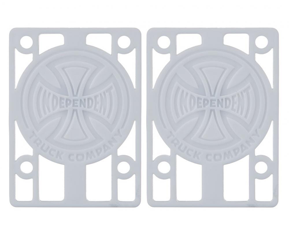 A pair of white skateboard risers featuring the "Independent Truck Company" logo with a cross design. The Independent Skateboard Riser Pads, measuring 1/8", have multiple slots for mounting and are perfectly compatible with Indy trucks.