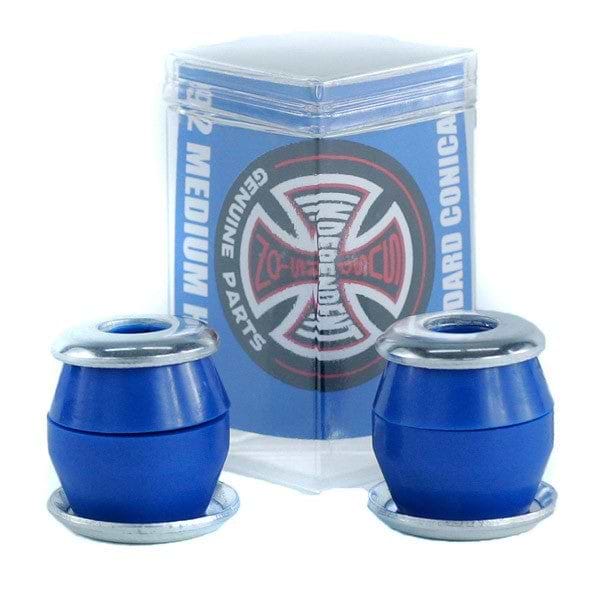 Close-up of a pair of Independent Standard Conical Blue Skateboard Bushings - 92A with silver edges displayed in front of a transparent package. Made from high rebound urethane, the packaging showcases a blue label adorned with a circular logo design, ideal for anyone looking for quality aftermarket bushings by Independent.