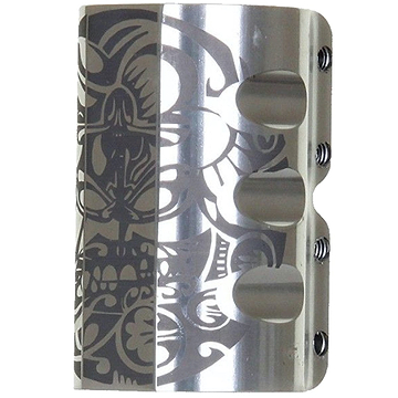 The Infinity Mayan 4 Bolt Oversized SCS Stunt Scooter Clamp in Raw Silver by Infinity features a durable metal structure with an intricate design, including skull motifs surrounded by swirling floral patterns.