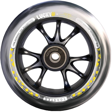 A detailed image of the wheel from the Lucky Toaster 110mm Stunt Scooter Wheel - Jon Marco Gaydos JMG Signature V4 highlights its sleek black design adorned with yellow floral patterns along the edge. The wheel features the brand name "Lucky" and includes text stating "one hundred ten millimeters" alongside "Lucky bearing technology," making it an ideal choice for fans of scooter accessories.