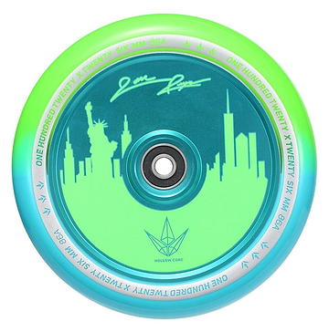 The Blunt Envy 120mm Jon Reyes Signature Hollow Core Stunt Scooter Wheel, designed in a dynamic green and teal color scheme, features an intricate city skyline that includes the Statue of Liberty. It showcases Jon Reyes' Signature with advanced Hollowcore Technology and has "One Hundred Twenty Six MM 86A" beautifully inscribed on the inner ring.