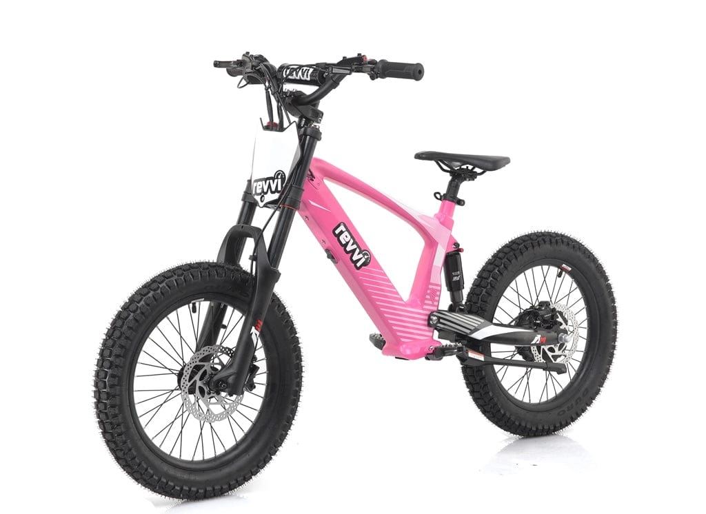 A striking pink Revvi 18" Kids Electric Balance Bike is set against a white backdrop, showcasing its robust frame, front suspension, and hydraulic disc brakes, ideal for off-road adventure.