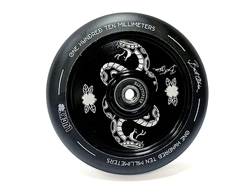 The Lucky Lunar 110mm Stunt Scooter Wheel - Bart Oskroba Signature showcases a detailed close-up featuring intricate snake and clover motifs on the hub. Ideal for scooter builds, the wheel highlights its size with white text reading "One Hundred Ten Millimeters," along with Lucky Rebound Technology and artistic elements.