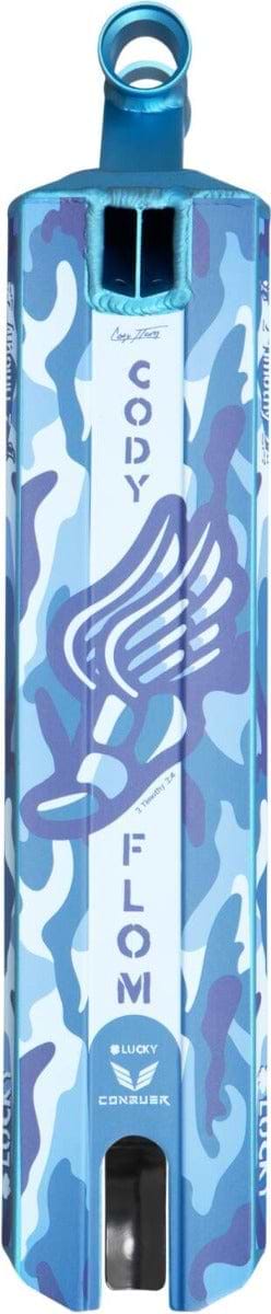 The Lucky Cody Flom Signature V4 Stunt Scooter Deck is highlighted by its distinctive blue and white camouflage graphics featuring Cody Flom's name alongside a stylized wing logo. Ideal for the scootering scene, it includes a grip cutout and rear wheel, combining style with functionality.